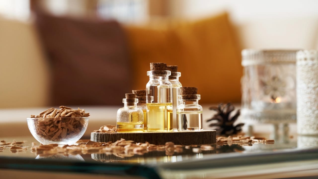 12 DIY Holiday Room Sprays to Bring Cheer to Every Room 9 12 DIY Holiday Room Sprays to Bring Cheer to Every Room - Bottles of aromatherapy essential oil with cedar wood dp739338786 dnop