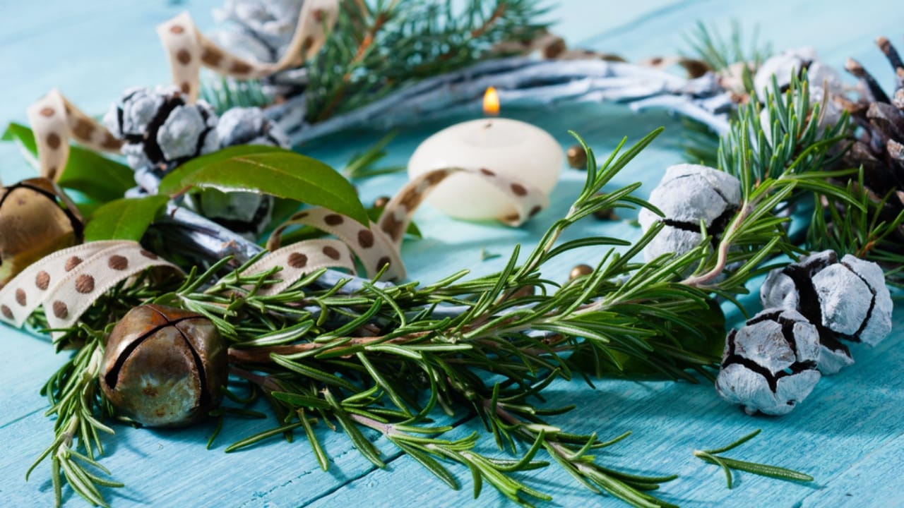 Craft Your Own Holiday Magic With a DIY Rosemary Wreath 8 Craft Your Own Holiday Magic With a DIY Rosemary Wreath - Christmas wreath on blue wood table ss1241078656 dpdgm