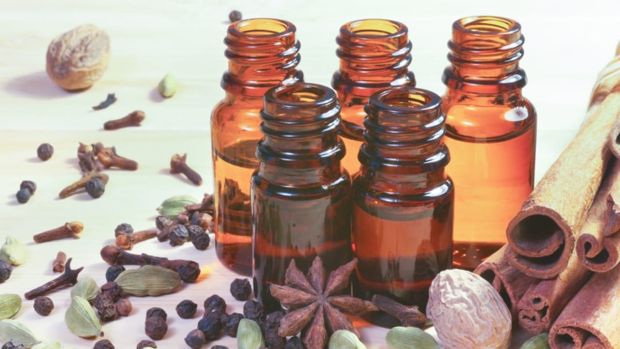 12 DIY Holiday Room Sprays to Bring Cheer to Every Room 11 12 DIY Holiday Room Sprays to Bring Cheer to Every Room - Essential oils in glass bottles and spices ss794011423 dnop