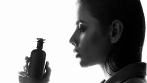 Perfumes That Made History: 17 Top-Selling Scents Worldwide 1 Perfumes That Made History: 17 Top-Selling Scents Worldwide - Girl holding a perfumes bottle ss1927700651 degm