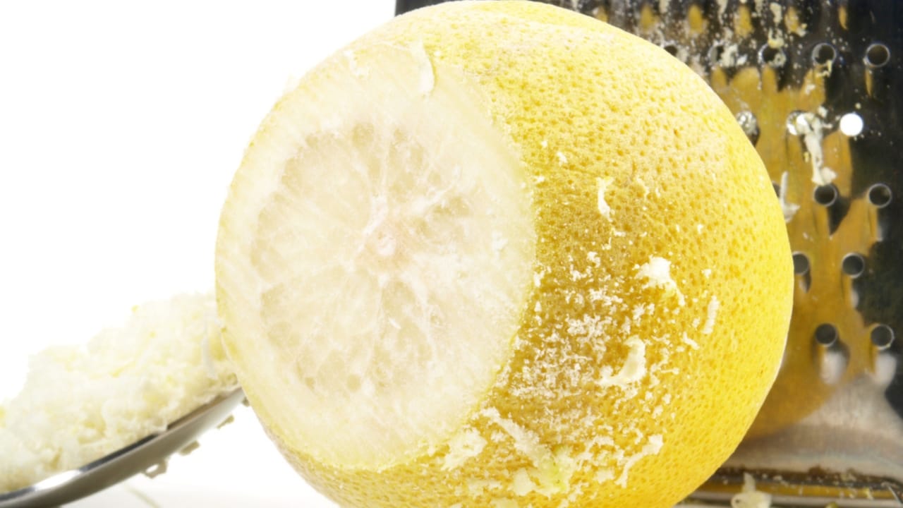 Unlock the Full Potential of Lemons by Freezing Them Whole 9 Unlock the Full Potential of Lemons by Freezing Them Whole - Grating a frozen Lemon Fruit ss1340920754 dpdgm
