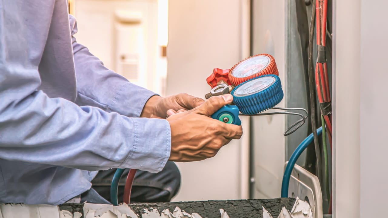 16 Home Projects That Could Land You in Legal Trouble 15 16 Home Projects That Could Land You in Legal Trouble - Man Converting Electric to Gas using manifold gauge dp471986940 dnoh