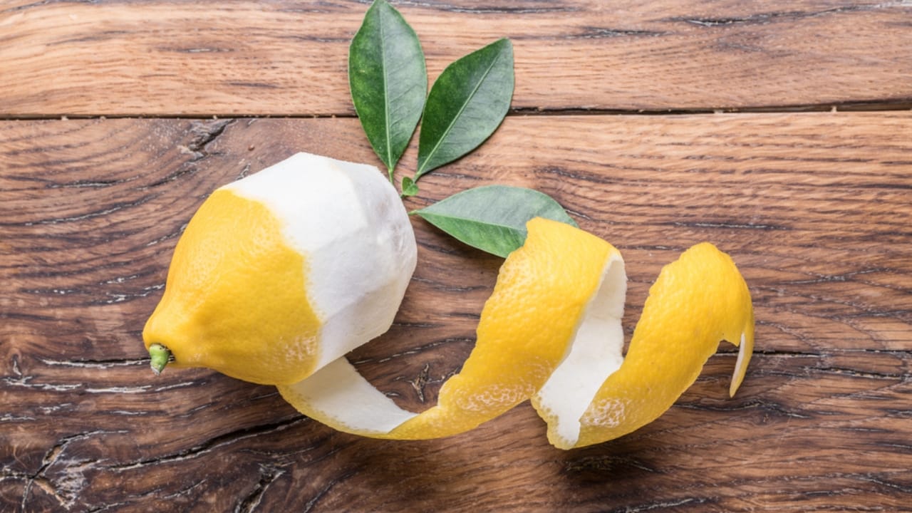 Don't Toss Those Lemon Peels... Make Lemon Powder Instead - Peeled lemon and lemon leaves dp184475006 dnoh