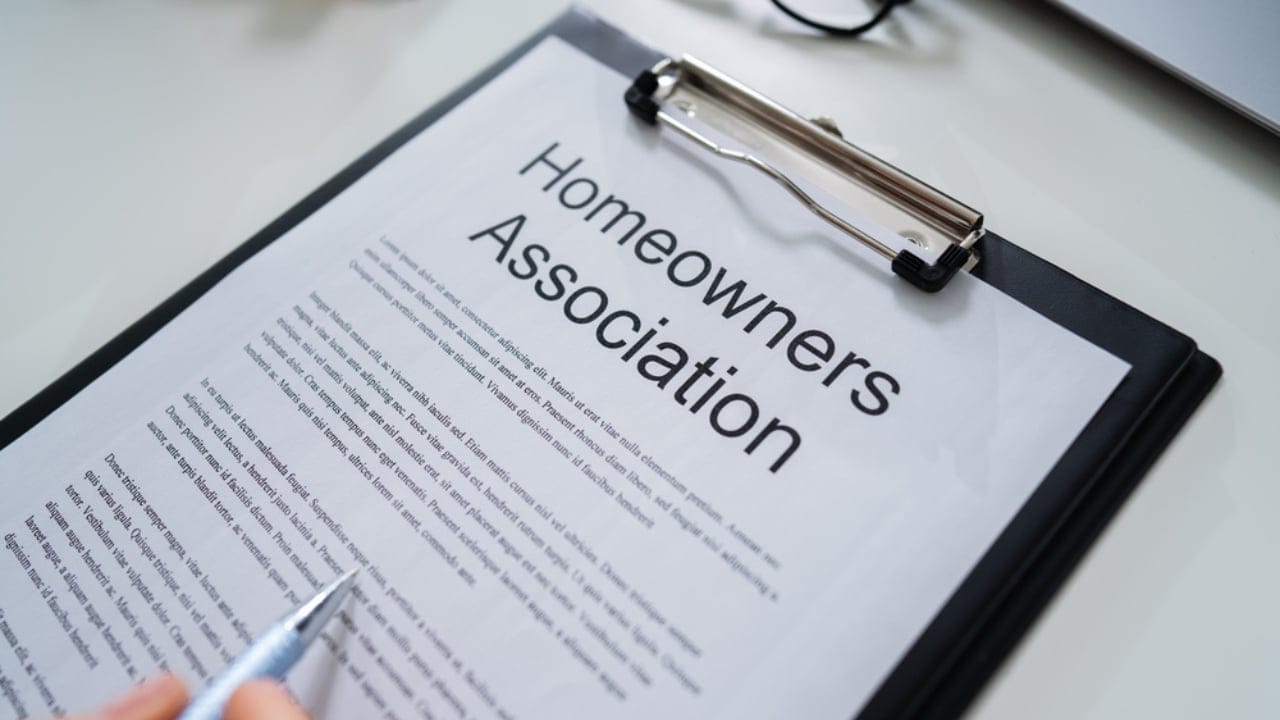 Homeowners Win: 15 HOA Powers That Stop at Your Door 7 Homeowners Win: 15 HOA Powers That Stop at Your Door - Person Reading HOA Rules dp342485018 dnoh