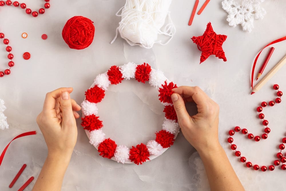 25 Unique Christmas Wreaths to Elevate Your Holiday Decor 8 25 Unique Christmas Wreaths to Elevate Your Holiday Decor - Pom Pom Wreath ss2404804811 dpdgm