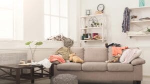 15 Design Mistakes That Could Be Making You Miserable at Home 1 15 Design Mistakes That Could Be Making You Miserable at Home - Sofa in messy room dp193916910 dnoh