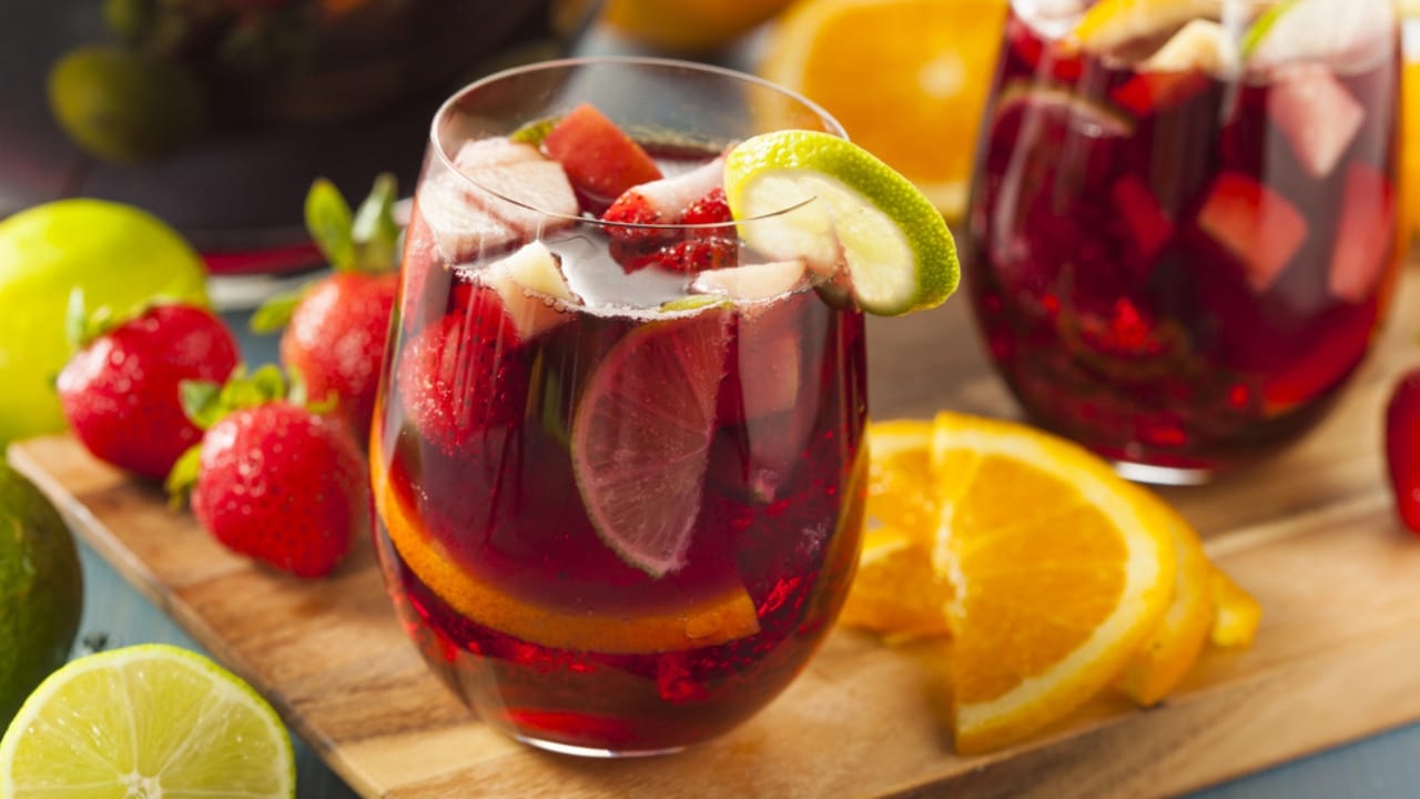 Holiday Fun Without Booze: 12 Easy Mocktail Recipes to Try 12 Holiday Fun Without Booze: 12 Easy Mocktail Recipes to Try - Sparkling Red Sangria Mocktail dp48733519 dnoh