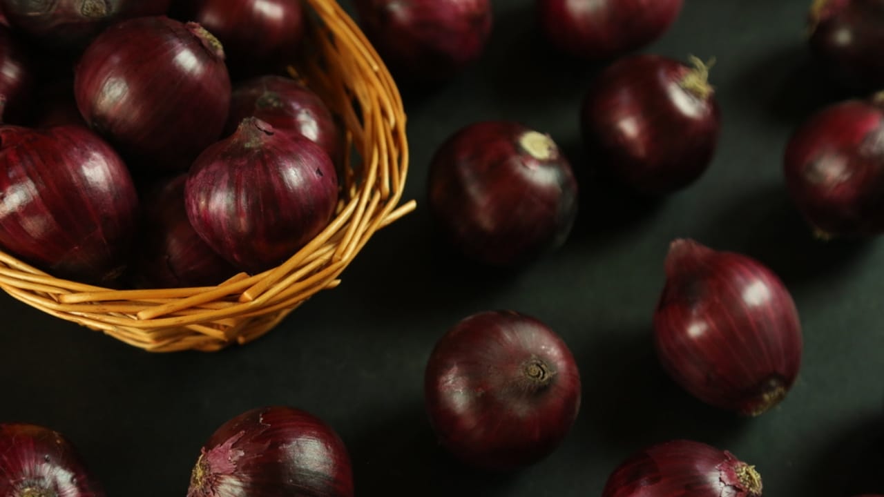 Beat Spoilage: How to Keep Onions Fresh for Months - Sweet red onions on background dp436713176 dnoh