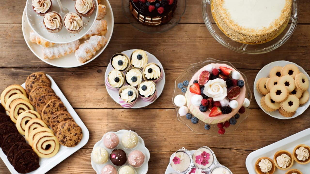 16 Foods You’d Never Guess Freeze Well—But They Do 16 16 Foods You’d Never Guess Freeze Well—But They Do - Table with cakes cookies cupcakes dp131256586 dnoh