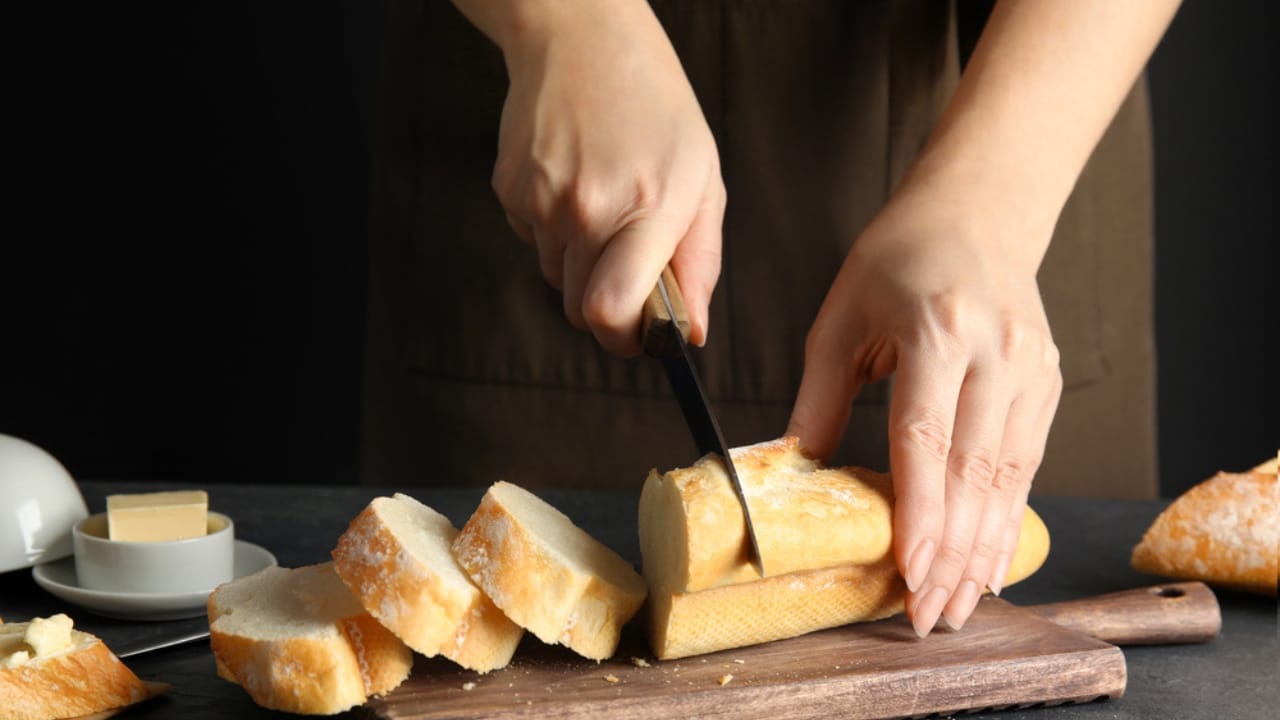 15 Ingenious Life Hacks from 100 Years Ago That Still Work 7 15 Ingenious Life Hacks from 100 Years Ago That Still Work - Woman cutting bread on wooden board dp252741526 dnoh