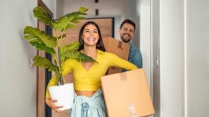 Get Paid to Move: 10 Global Destinations Offering Cash 1 Get Paid to Move: 10 Global Destinations Offering Cash - Young couple moving in new home ss2188934463 degm