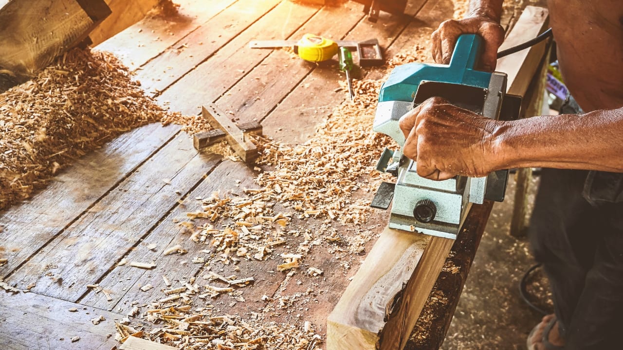 12 Leaf Blower Hacks That Will Change How You Use It Year-Round 6 12 Leaf Blower Hacks That Will Change How You Use It Year-Round - carpenter using electric planer ss639606352 degm