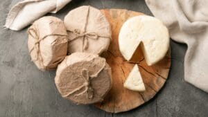 Stop Wasting Cheese: 5 Plastic-Free Ways to Keep It Fresh 1 Stop Wasting Cheese: 5 Plastic-Free Ways to Keep It Fresh - cheese cut ss1749411668 dnoh