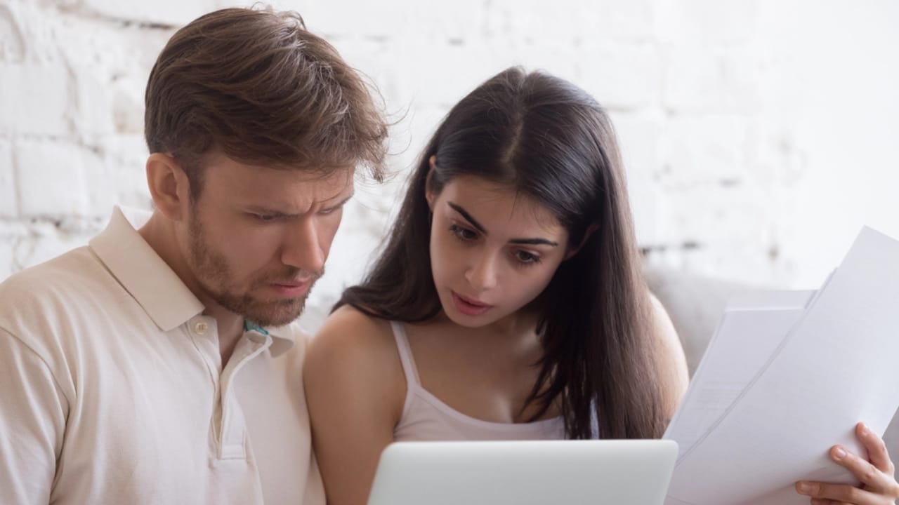 Homeowners Win: 15 HOA Powers That Stop at Your Door 12 Homeowners Win: 15 HOA Powers That Stop at Your Door - couple checking bills dp219681942 dnoh