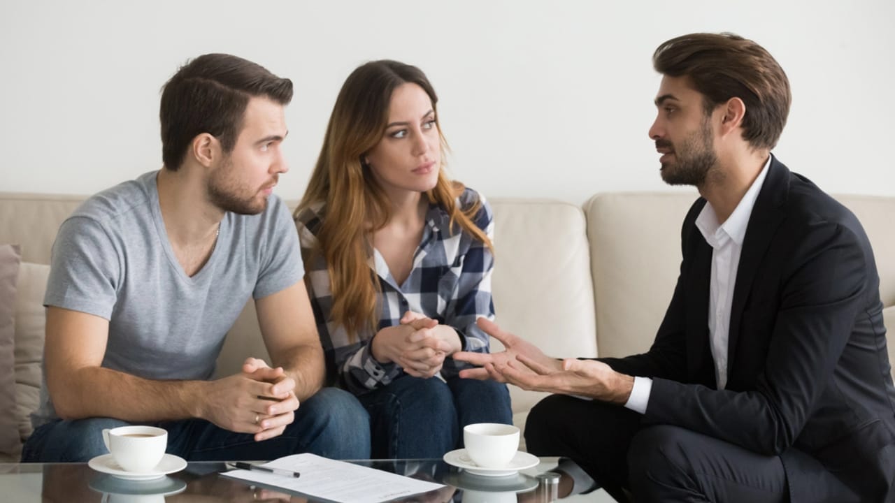 Homeowners Win: 15 HOA Powers That Stop at Your Door 8 Homeowners Win: 15 HOA Powers That Stop at Your Door - family at meeting with realtor dp222480304 dnoh