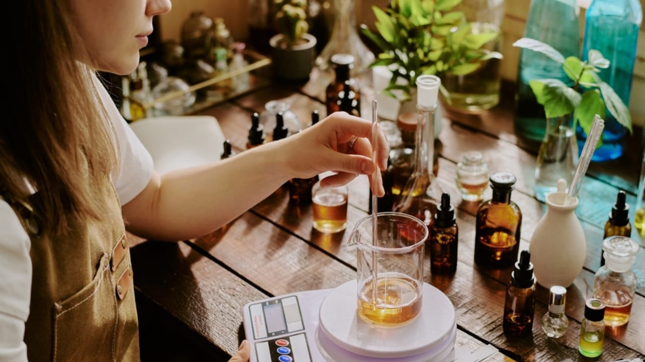 25 Creative DIY Gifts for a Memorable Holiday Season - female perfumer blending essential oils ss2480519155 dpdgm