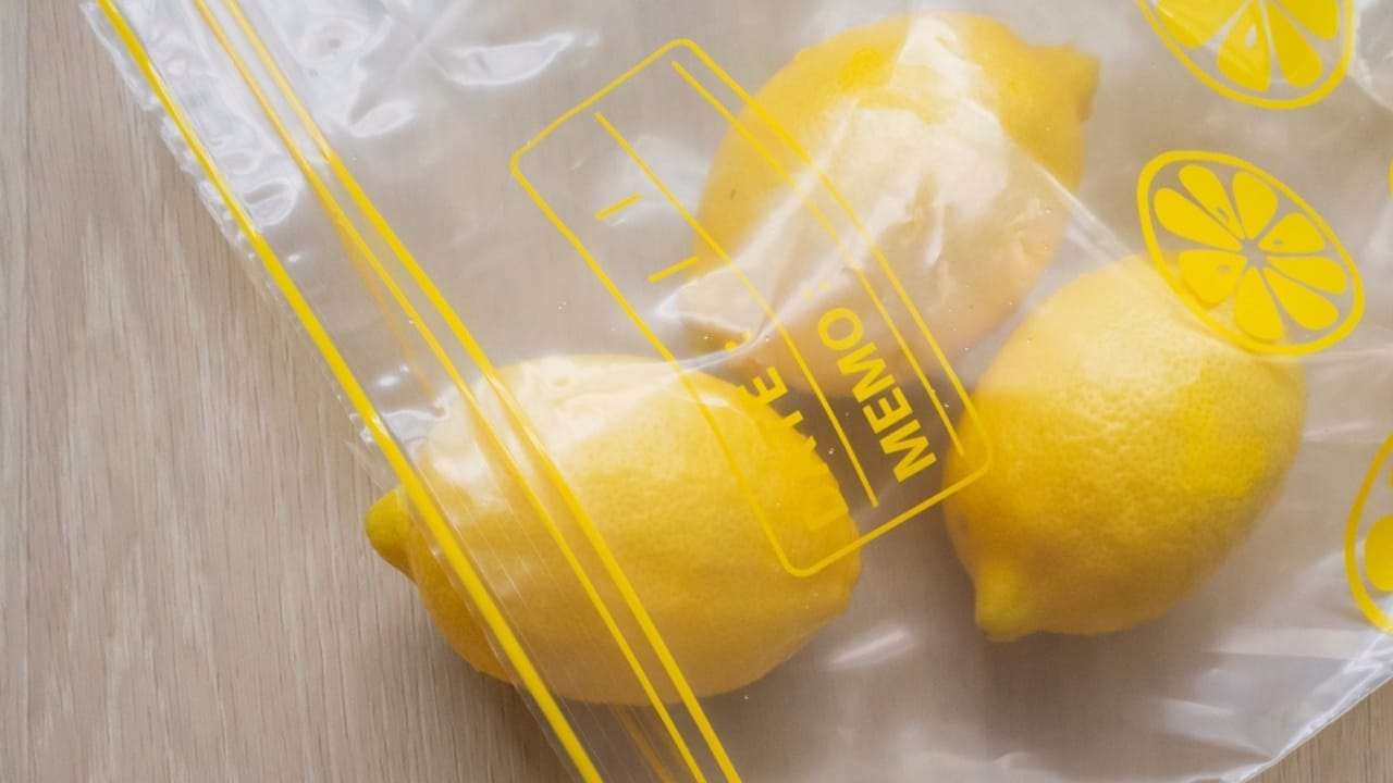 Unlock the Full Potential of Lemons by Freezing Them Whole 3 Unlock the Full Potential of Lemons by Freezing Them Whole - fresh lemons in a food storage bag ss2163106609 dpdgm