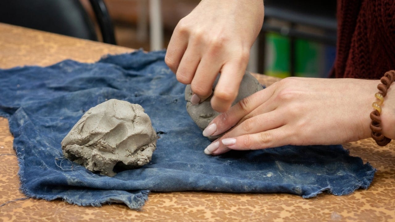 Dryer Lint Hacks: 11 Smart Uses You’ll Want to Try 10 Dryer Lint Hacks: 11 Smart Uses You’ll Want to Try - girl holding clay dp221653650 dnoh