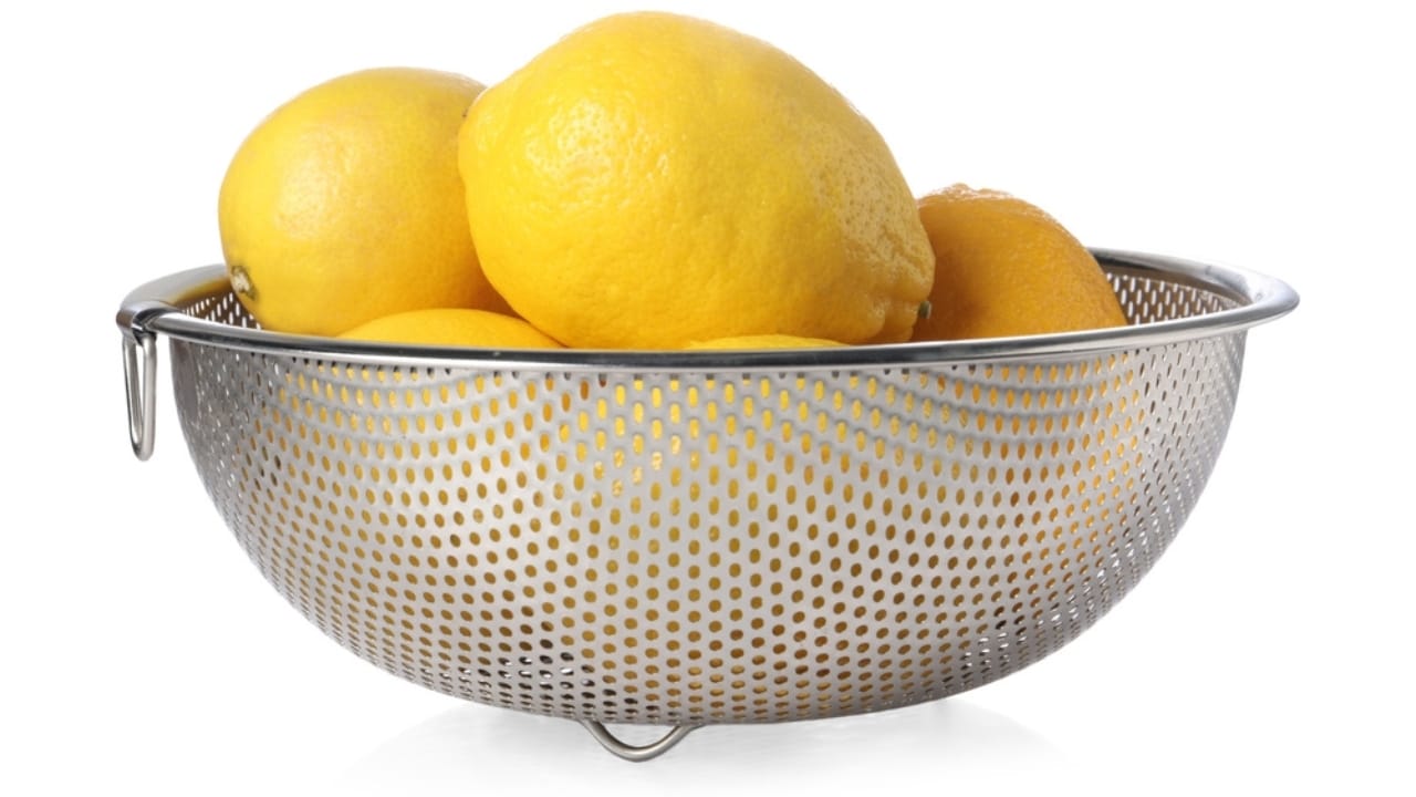 Don't Toss Those Lemon Peels... Make Lemon Powder Instead - lemon in strainer ss2459357947 dpdgm