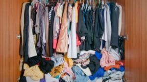 16 Space-Wasting Closet Items to Throw Out Right Now 1 16 Space-Wasting Closet Items to Throw Out Right Now - messy closet ss601072265 degm