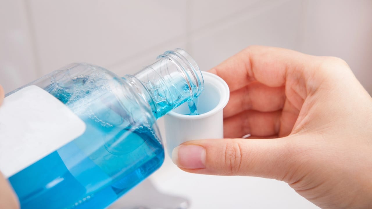 These 15 Household Items Can Change the Way You Do Laundry 13 These 15 Household Items Can Change the Way You Do Laundry - mouthwash pouring dp38712873 dnoh