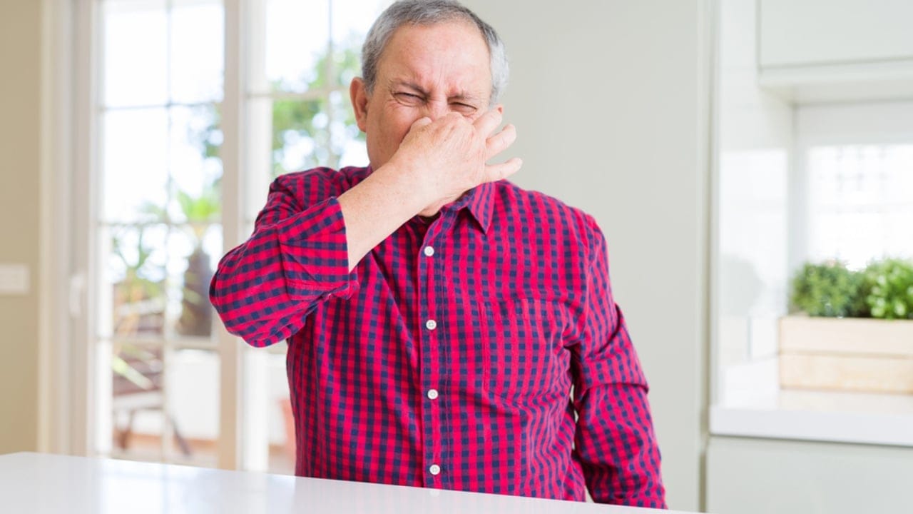 8 Easy Ways to Get Rid of That Musty "Old House" Smell 3 8 Easy Ways to Get Rid of That Musty "Old House" Smell - old man covering nose smelly inside house dp263912116 dnoh
