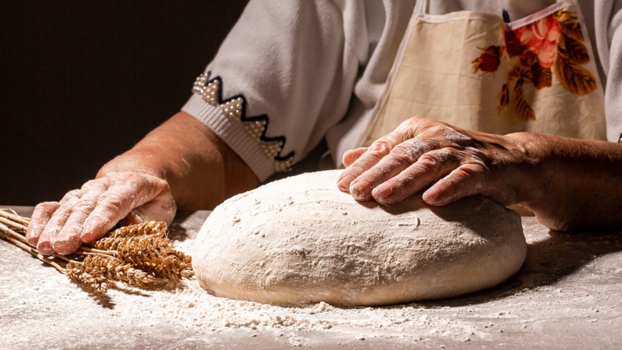 Flour Gone Bad? 5 Warning Signs to Watch For - old woman making bread dp409807282 dnoh