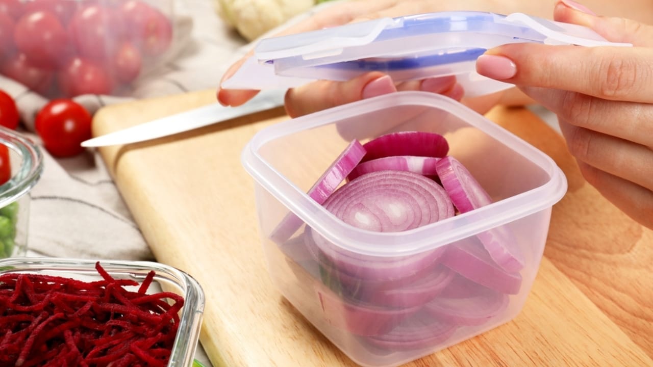 Beat Spoilage: How to Keep Onions Fresh for Months - plastic container with lid at table ss2374483629 dpdgm