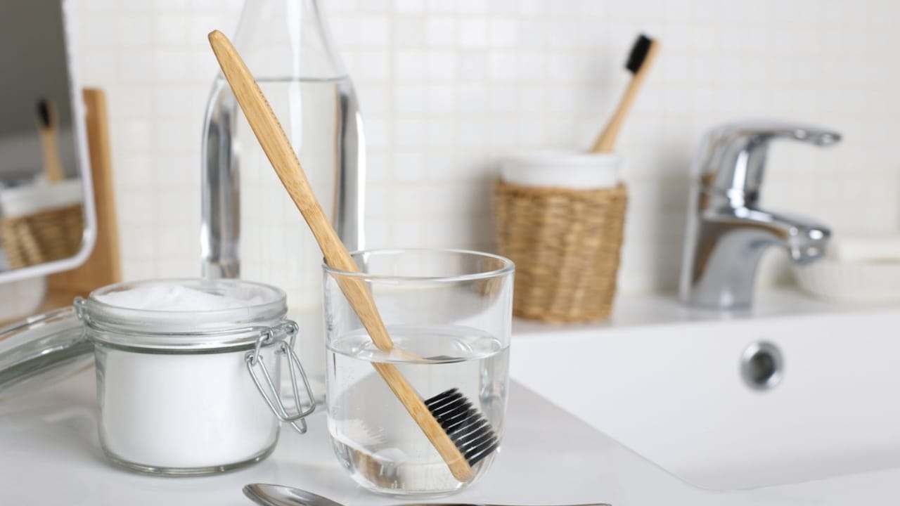 Stop Storing These 15 Things in the Bathroom—Here’s Why - soak toothbrush dp2120258672 dnoh