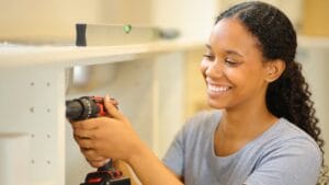 20 DIY Fixes Anyone Can Do to Save Money 1 20 DIY Fixes Anyone Can Do to Save Money - woman homeowner diy ss2473373585degm