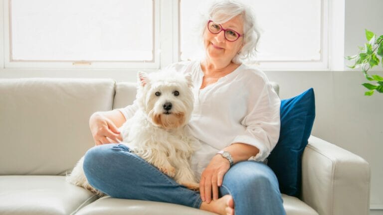 15 Dog Breeds Perfect for Seniors Seeking Loyal Companions 8 15 Dog Breeds Perfect for Seniors Seeking Loyal Companions - woman white dog ss1345460732 degm