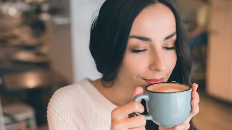 67% of Americans Drink Coffee Daily—Here are 10 Top Brands to Try 2 67% of Americans Drink Coffee Daily—Here are 10 Top Brands to Try - woman drinking coffee dp214806502 dnoh