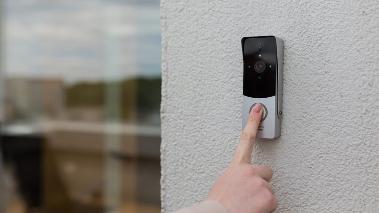 The Dark Side of Smart Doorbells: 14 Dangers You Shouldn’t Ignore 12 The Dark Side of Smart Doorbells: 14 Dangers You Shouldn’t Ignore - woman hand uses a doorbell ss2013939422 dpdgm