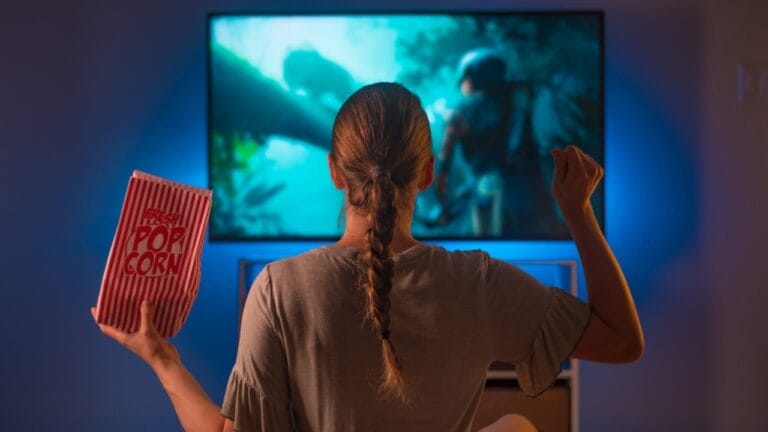10 Free Streaming Platforms That Rival Paid Services - woman with popcorn ss2109330671 dnoh