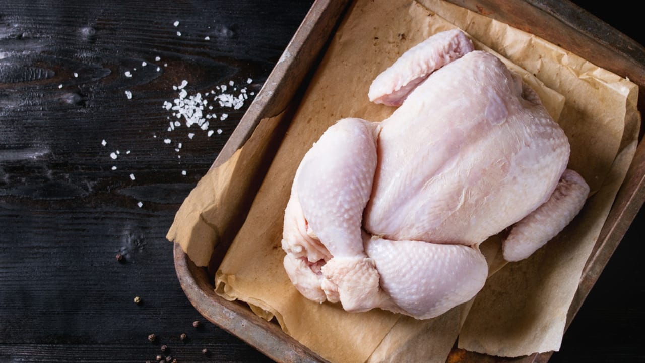 10 Steps to Perfect Roast Chicken for the Holidays 4 10 Steps to Perfect Roast Chicken for the Holidays - Raw organic uncooked whole chicken with salt ss615056252 dpdgm