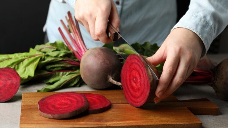 Beetroot Ranked Among Top Antioxidant Vegetables: Here’s Why 3 Beetroot Ranked Among Top Antioxidant Vegetables: Here’s Why - Woman cutting fresh red beet at table dp85741086 dnoh