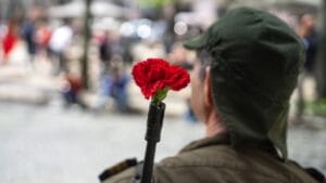 Delicate Blooms Became Powerful Symbols of Defiance 1 Delicate Blooms Became Powerful Symbols of Defiance - soldier celebrating 25th of april ss1338349604 dnoh