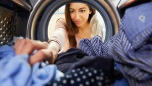 These 15 Household Items Can Change the Way You Do Laundry 1 These 15 Household Items Can Change the Way You Do Laundry - woman laundry ss236885437 degm